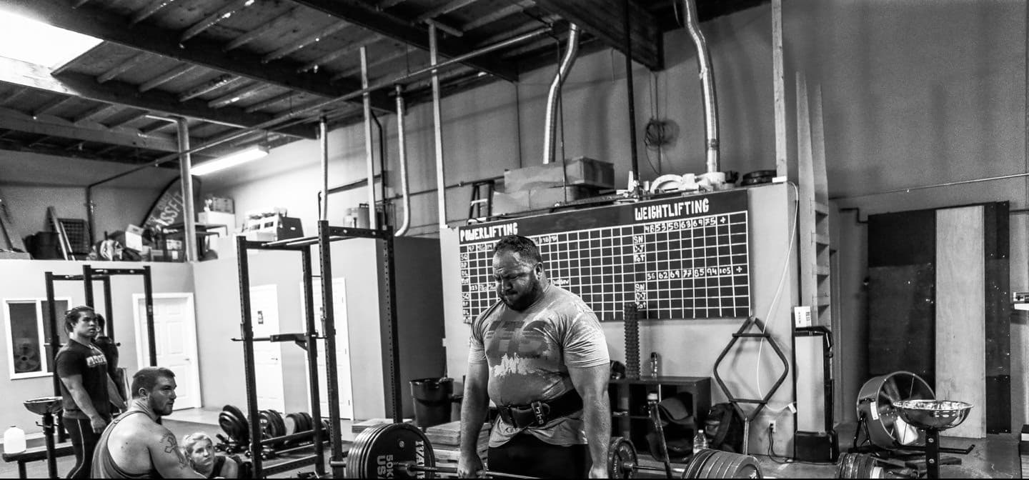 Lifter training with a loaded barbell in the gym